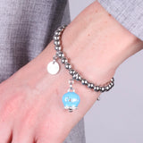 Bracciale in Acciaio con campanella azzurra con scritta Capri
