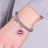 Bracciale in Acciaio a perline con campanella borgogna con scritta Capri