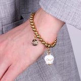 Bracciale in Acciaio con campanella bianca e oro con scritta Capri