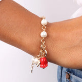 Bracciale in Metallo con perle con campanella a forma di rosa