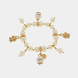 Bracciale in Metallo con perle e campanelle portafortuna in smalto bianco con scritta Capri