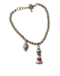 Bracciale con faro pendente e piccolo pumo a lato