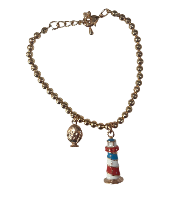 Bracciale con faro pendente e piccolo pumo a lato