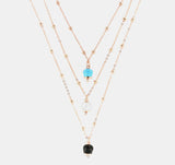 Collana tre fili con campanella nera, bianca e turchese