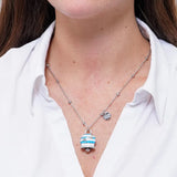 Collana in Acciaio con campanella a strisce celesti e bianche con scritta Capri
